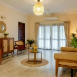 Bright living room with wooden furniture and plants